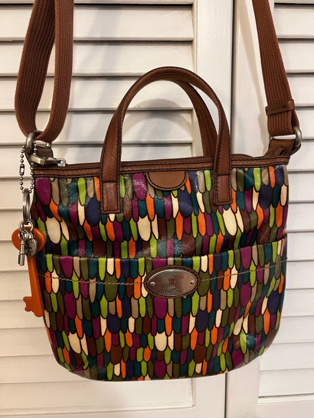 Fossil Calypso Key-Per multi-color feather print coated canvas bag Excellent